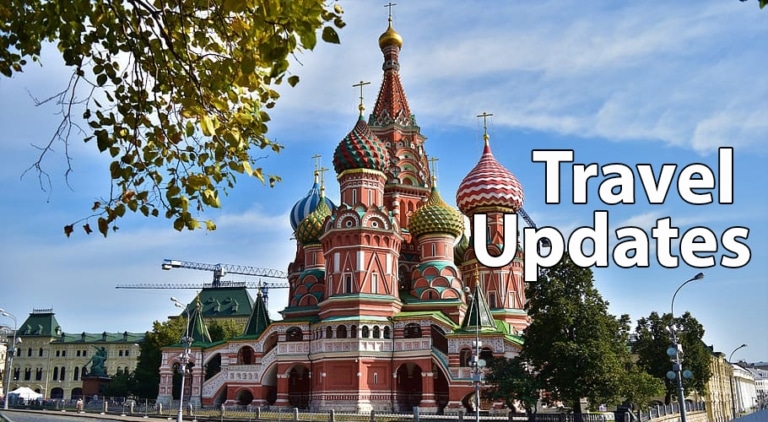 St. Basil's Cathedral in Moscow under a blue sky, with a 'Travel Updates' banner overlaid on the image.