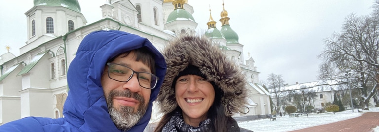Molly and Gela Turabelidze pose together in front of St. Sophia Cathedral in Kyiv, Ukraine, in winter.