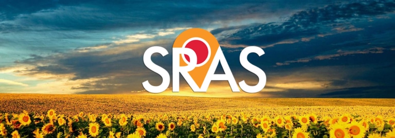 Field of yellow sunflowers under a blue sky with SRAS logo.