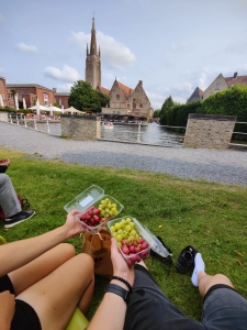 Enjoying grapes with a friend in Belgium