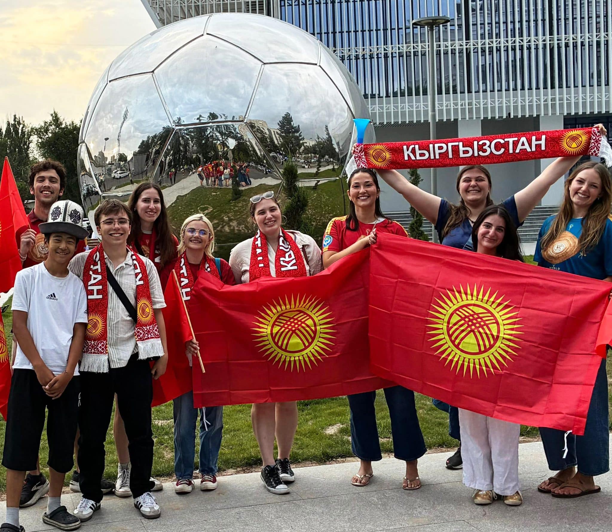 Students attend a local soccer match with local peers.