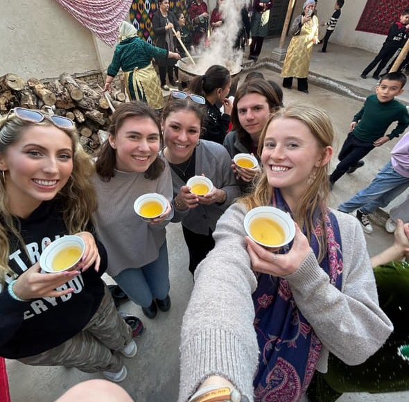Students treated to tea in Uzbekistan during Navruz.