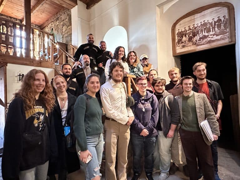 Students attending a workshop with professional Georgian folk singers.