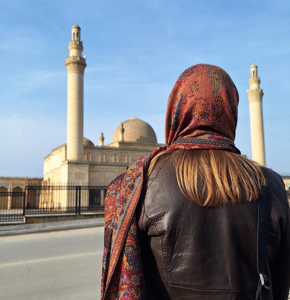 A student prepares to explore Juma Mosque in Shamakhi, Azerbaijan, one of the oldest mosques in the Caucasus region.