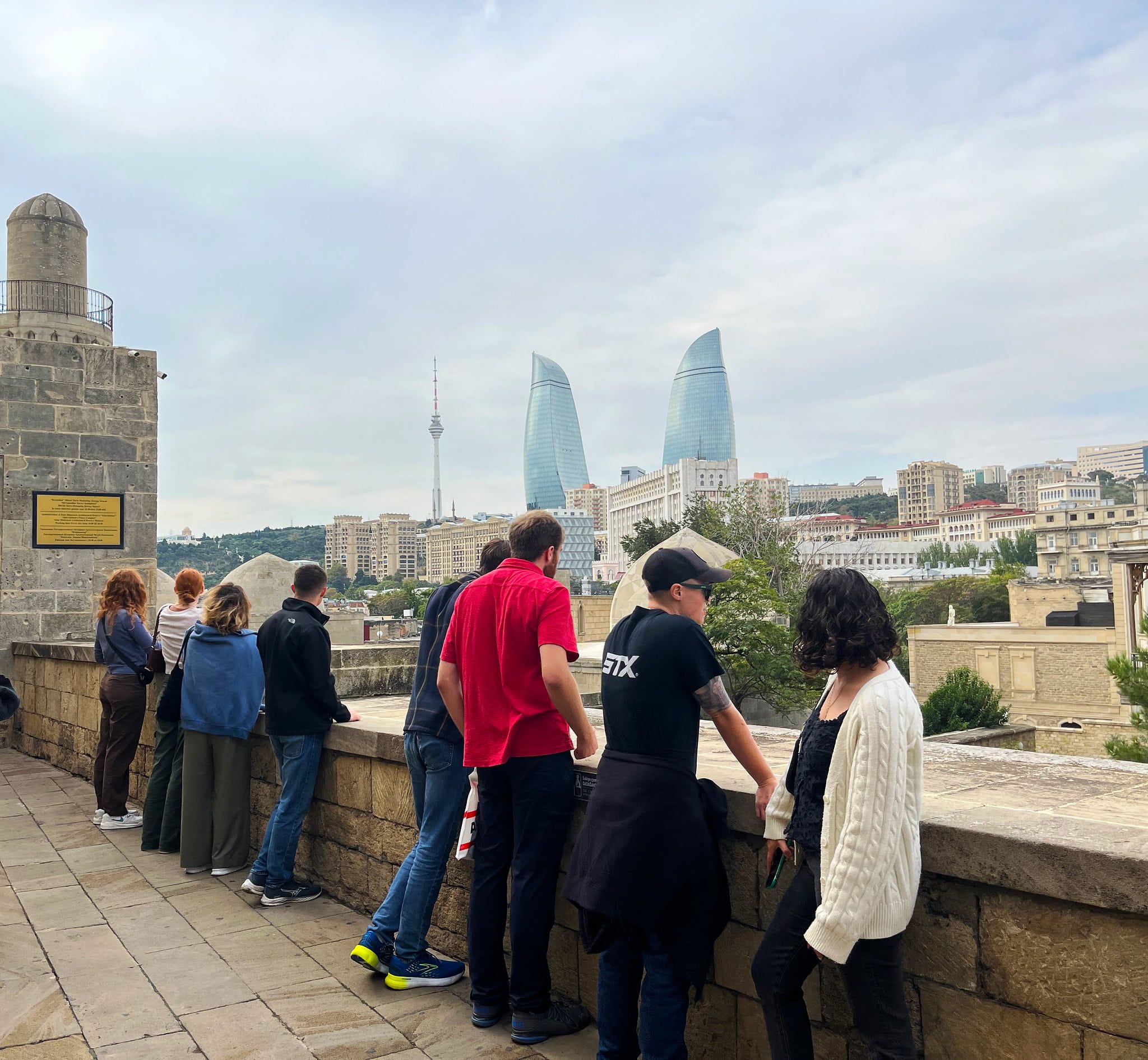 Students with Baku's iconic flame towers.