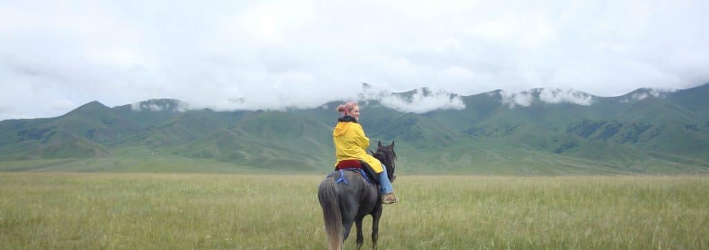 Anya Bernard on horseback in Kyrgyzstan
