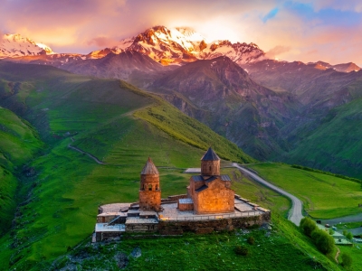 Aerial view of Gergeti trinity church at sunrise in Georgia.